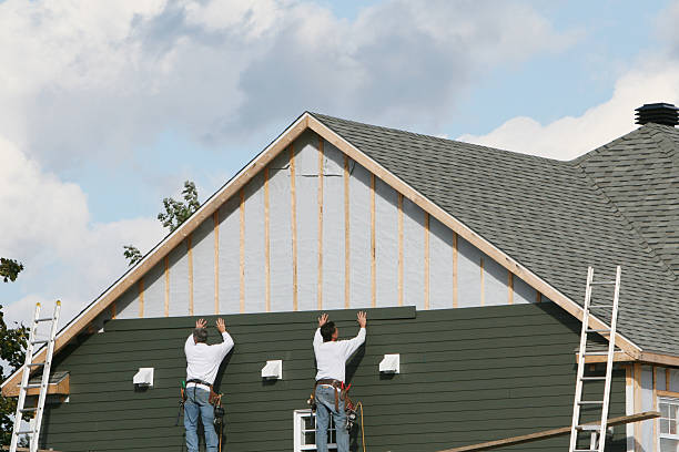 Professional Storm Damage Siding Repair technician working in Urbanna, VA